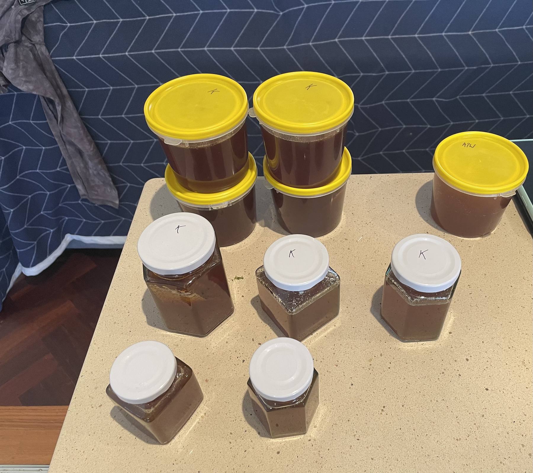 Uncapping a frame of honey with a hand tool